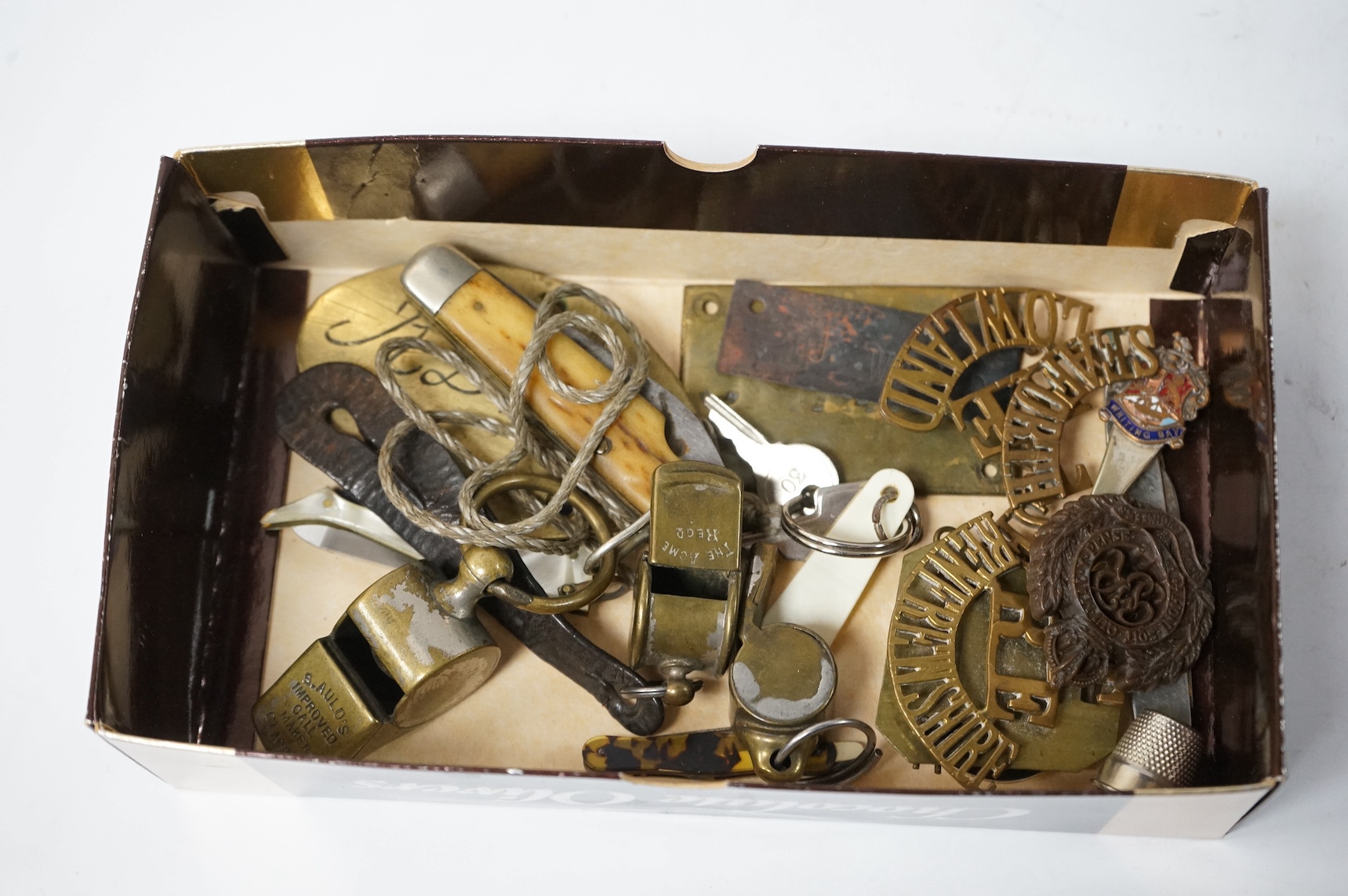 A collection of military medals, shoulder titles, whistles, etc. including; a WWI medal trio to 19698 PTE. T. Campbell. 10-CAN. INF., a miniature trio, four WWII medals; the Burma Star, the 1939-1945 Star, the Defence Me